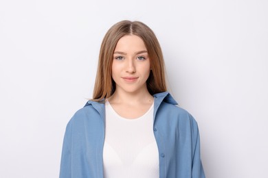 Photo of Portrait of teenage girl on white background