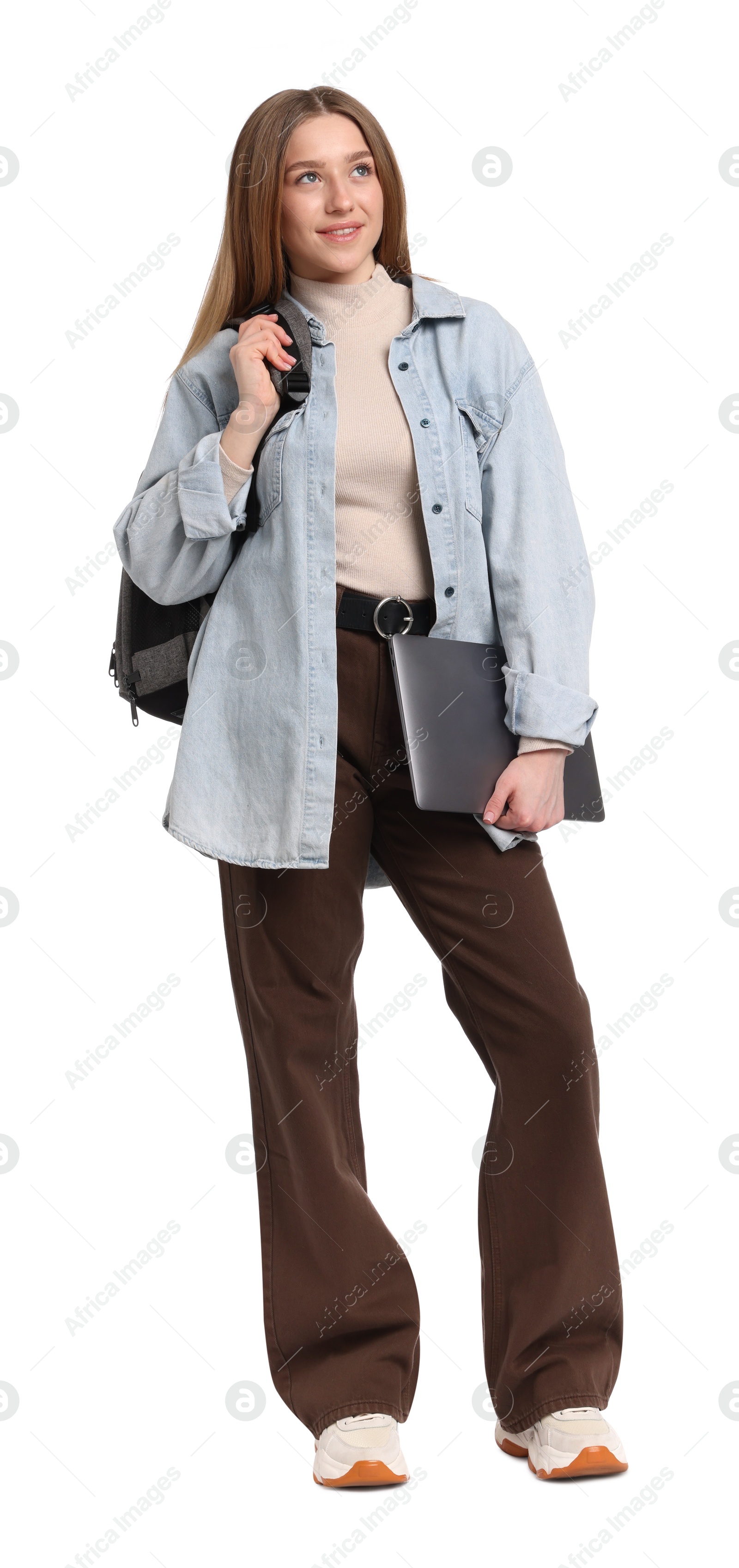 Photo of Smiling teenage girl with laptop on white background
