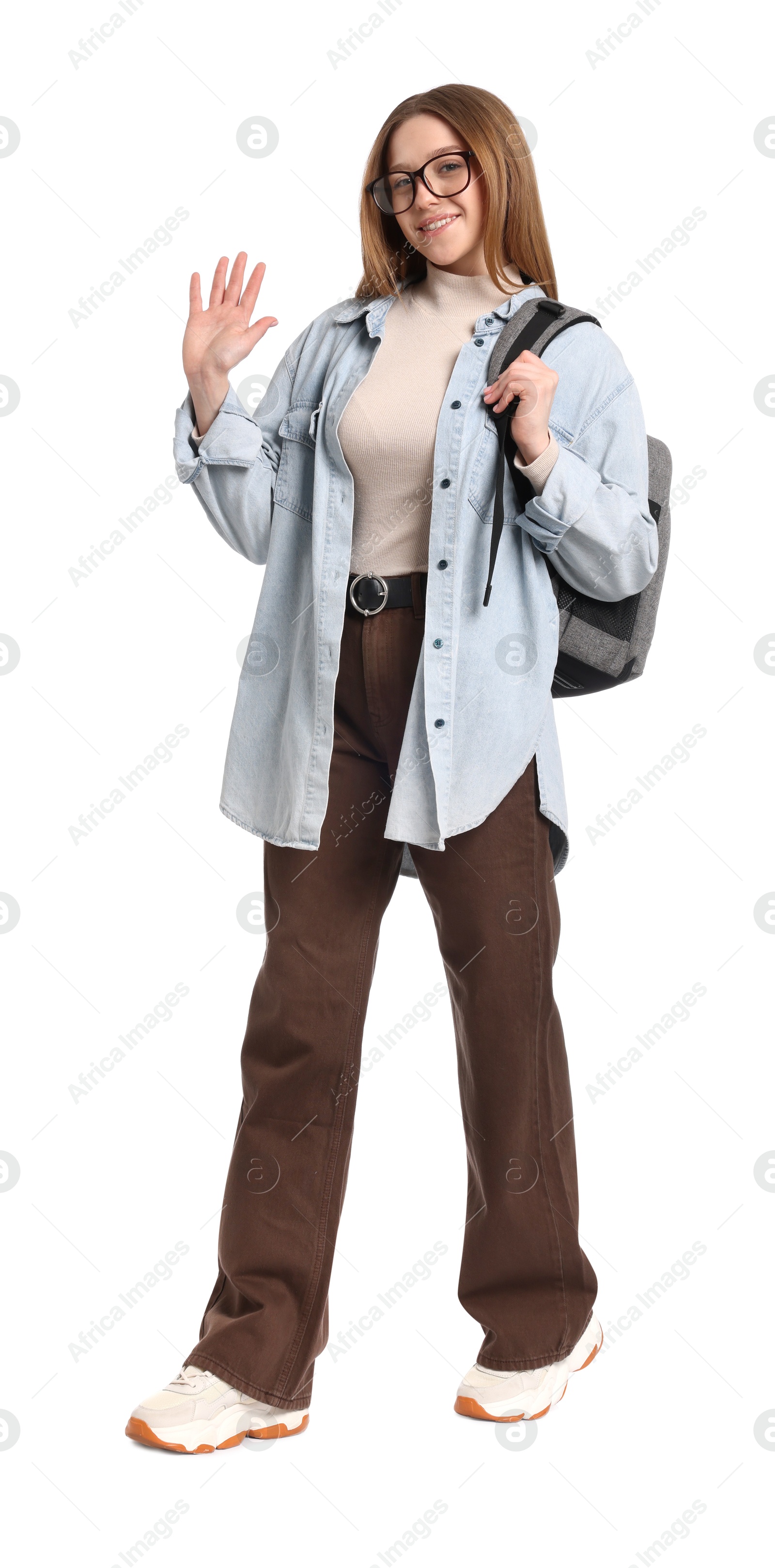 Photo of Smiling teenage girl with backpack on white background