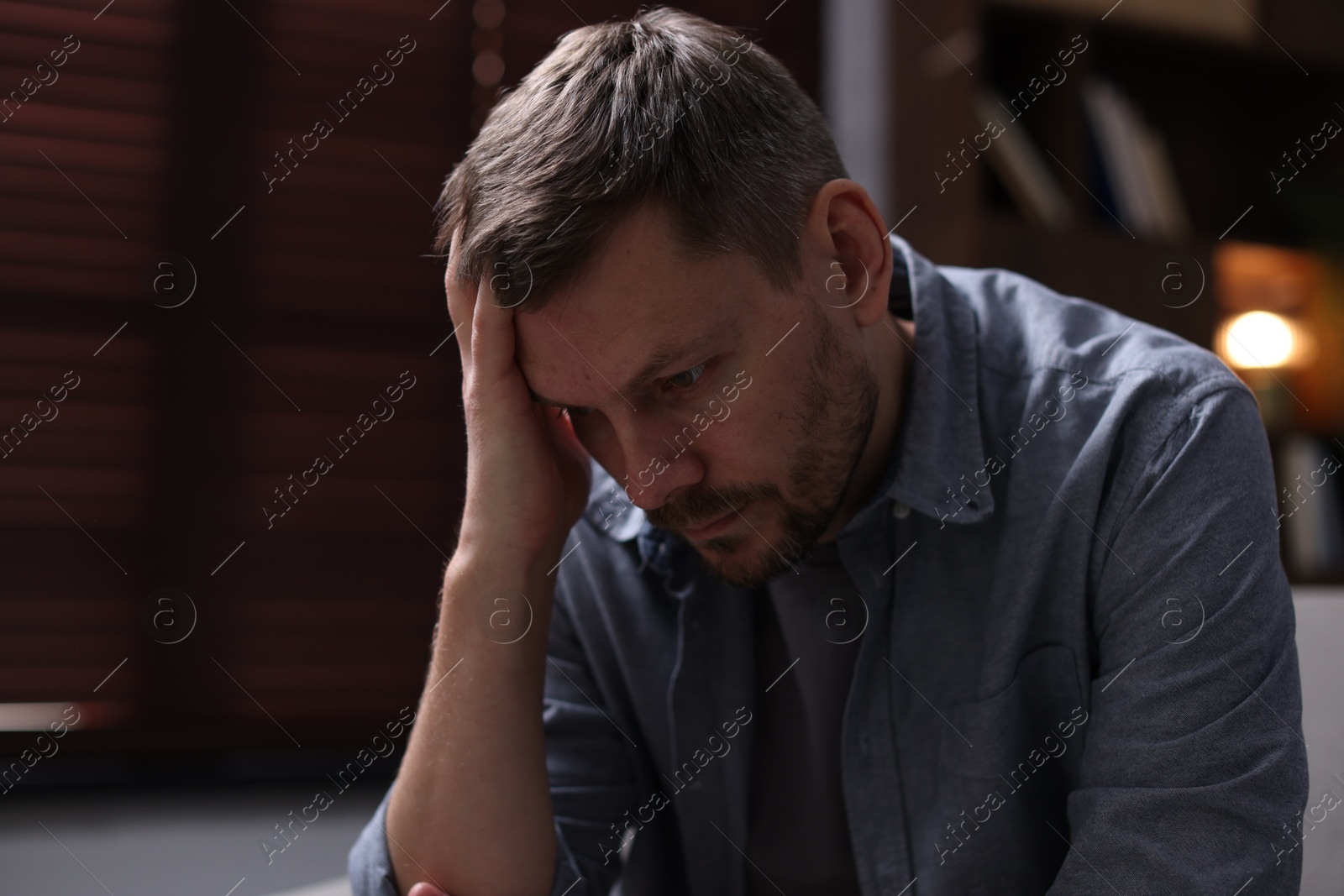 Depressed man at home. Mental health problem Photo of Depressed man at home. Mental health problem