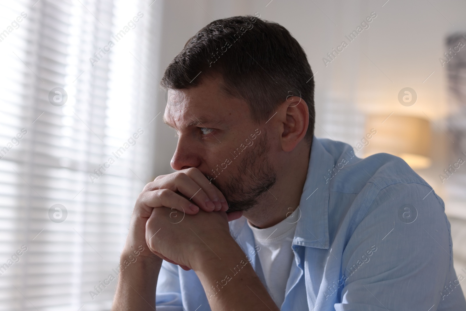 Depressed man at home. Mental health problem Photo of Depressed man at home. Mental health problem