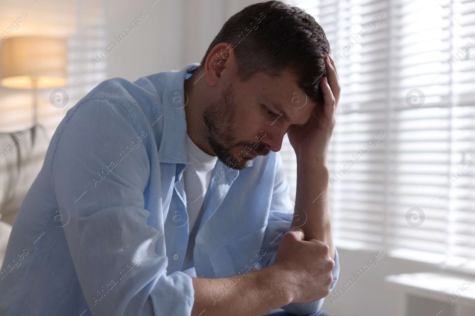 Depressed man at home. Mental health problem Photo of Depressed man at home. Mental health problem