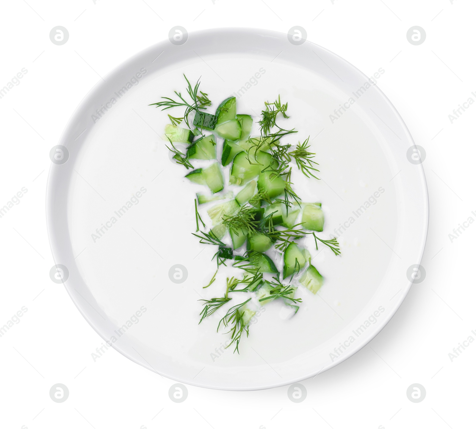 Tasty cucumber soup with dill in bowl isolated on white, top view Photo of Tasty cucumber soup with dill in bowl isolated on white, top view