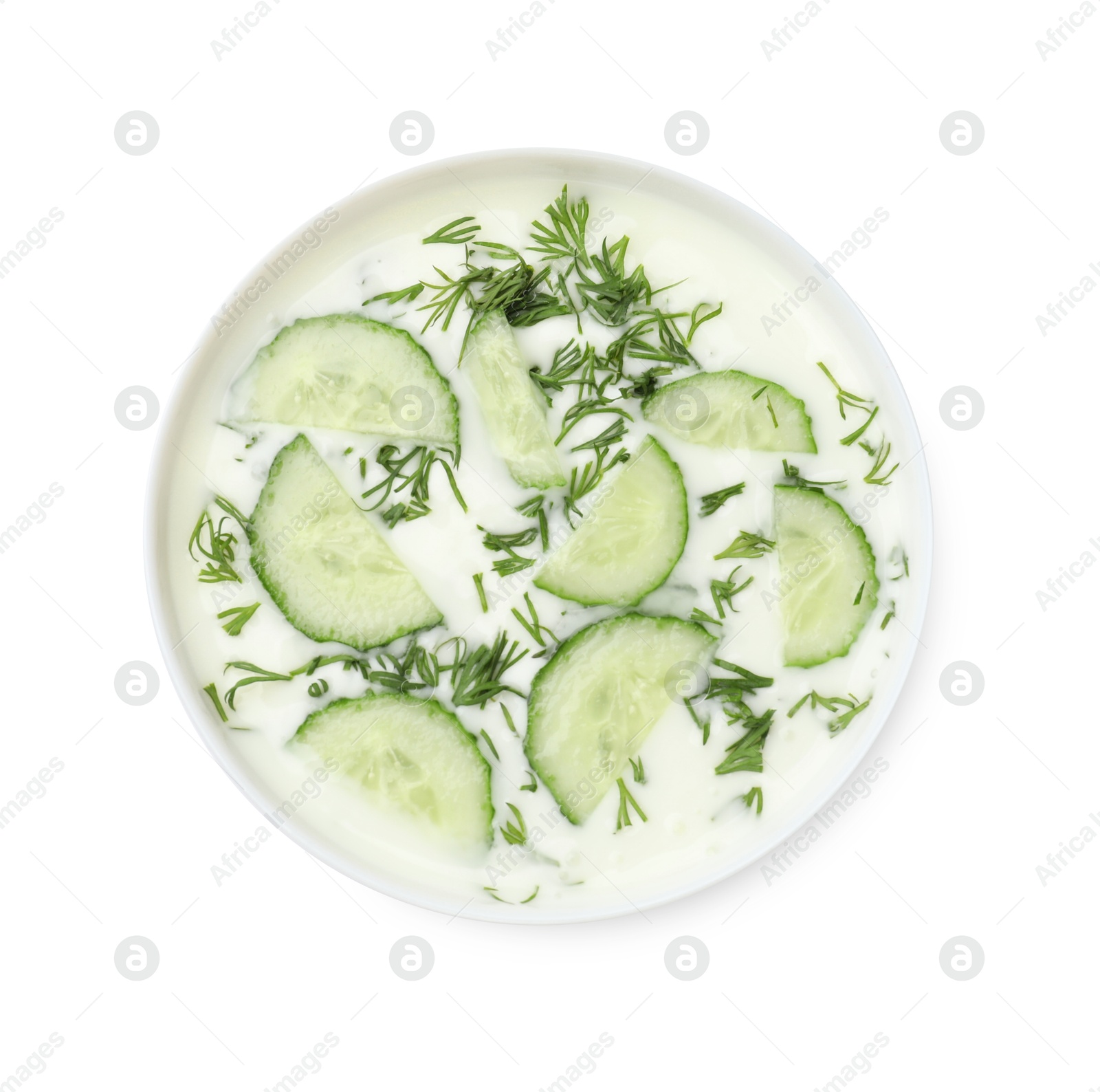 Tasty cucumber soup with dill in bowl isolated on white, top view Photo of Tasty cucumber soup with dill in bowl isolated on white, top view
