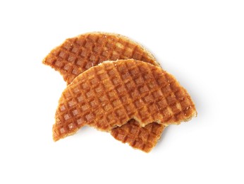 Photo of Pieces of tasty round waffle isolated on white, top view