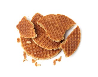 Photo of Pieces of tasty waffles isolated on white, top view