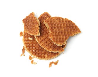 Photo of Pieces of tasty waffles isolated on white, top view