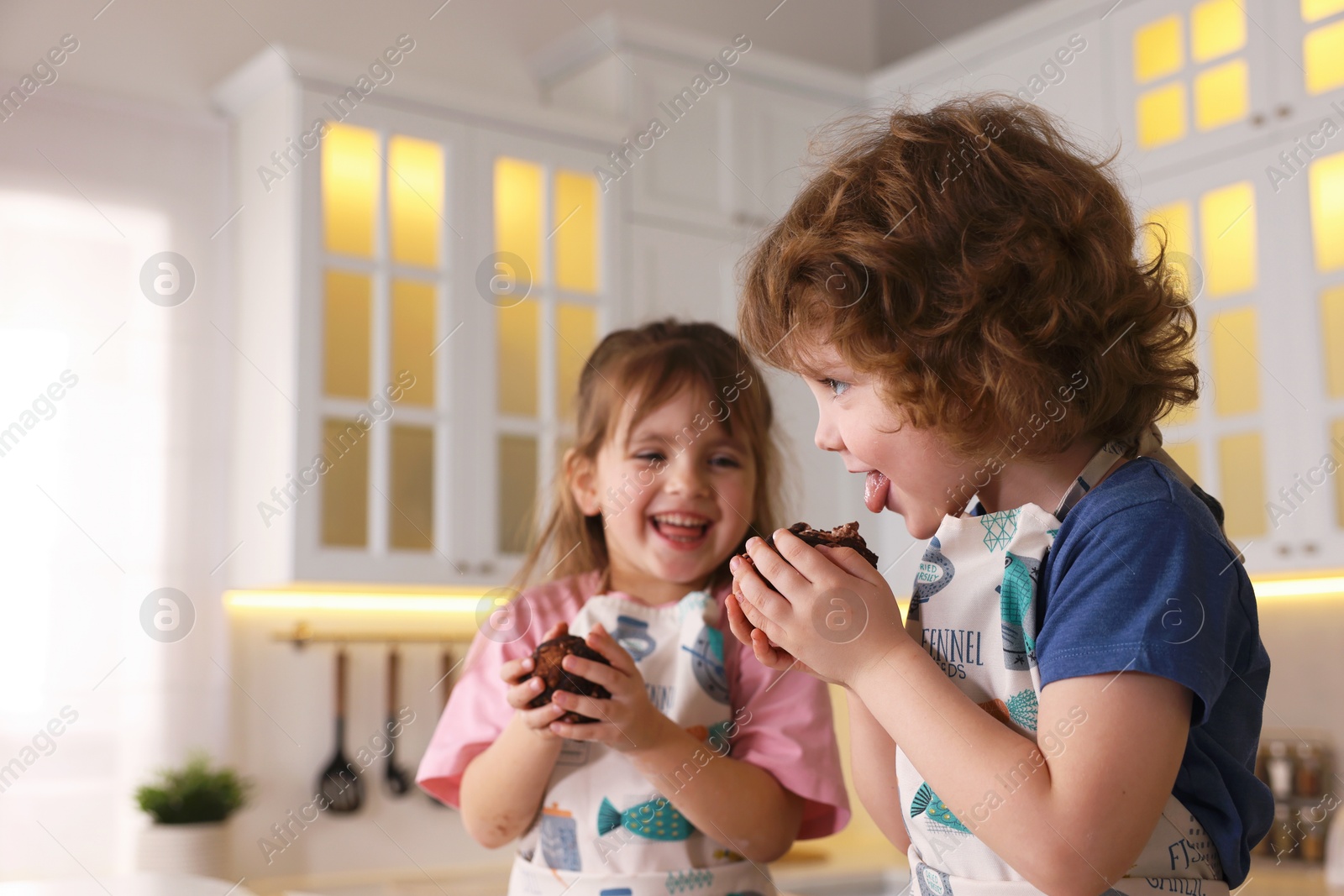Cooking recipe. Little children with cookie dough having fun in kitchen. Space for text Photo of Cooking recipe. Little children with cookie dough having fun in kitchen. Space for text