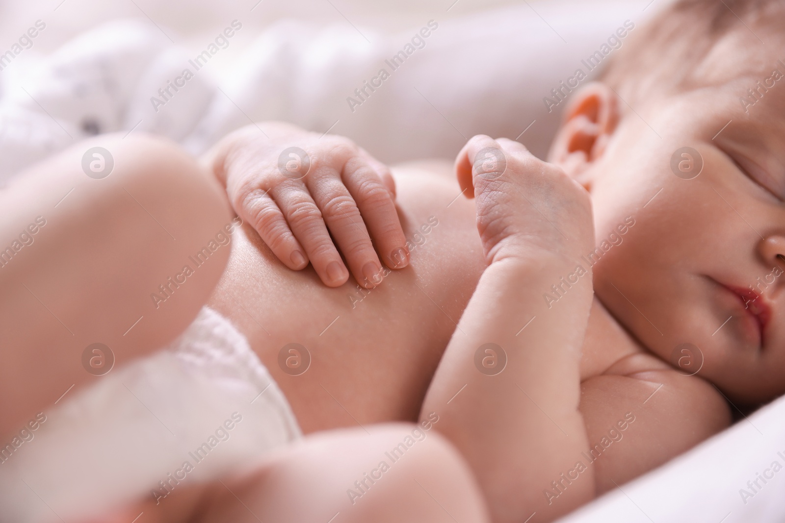 Little baby sleeping in bed indoors, closeup Photo of Little baby sleeping in bed indoors, closeup