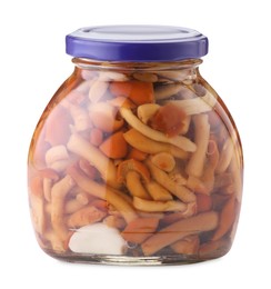 Photo of Tasty pickled mushrooms in jar isolated on white