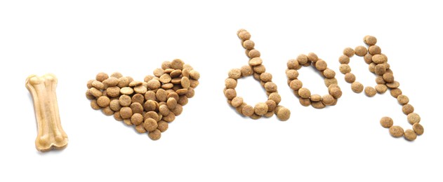 Photo of Phrase I love dog made of dry pet food and chew bone isolated on white