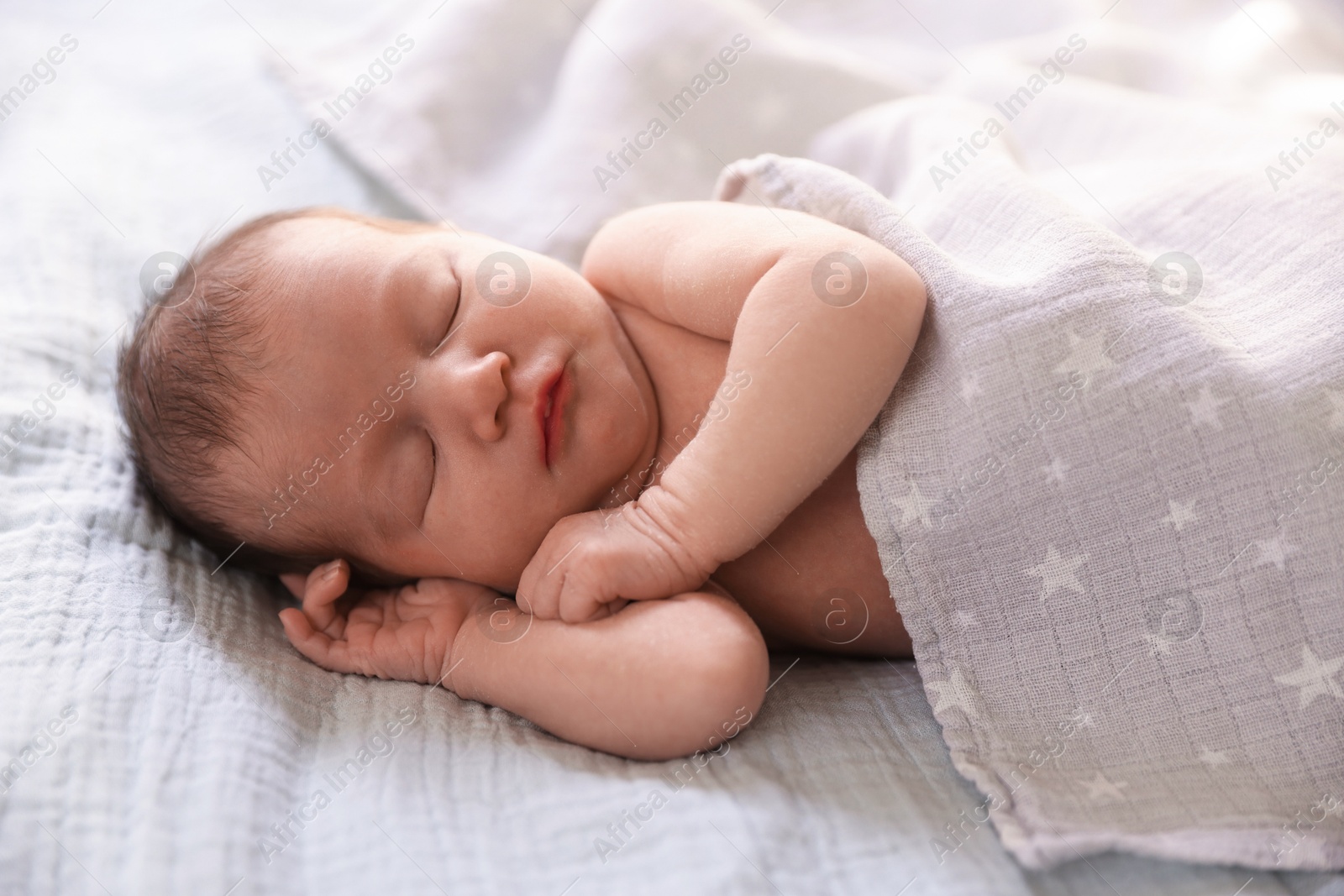 Bedtime. Cute little baby sleeping in bed indoors Photo of Bedtime. Cute little baby sleeping in bed indoors