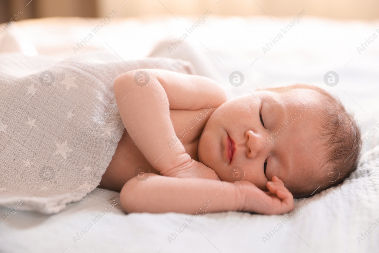 Bedtime. Cute little baby sleeping in bed indoors Photo of Bedtime. Cute little baby sleeping in bed indoors