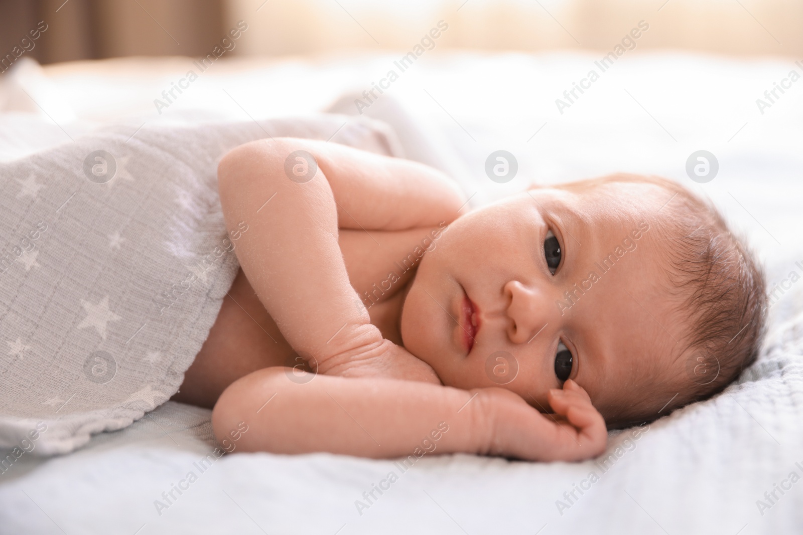 Bedtime. Cute little baby lying on bed indoors Photo of Bedtime. Cute little baby lying on bed indoors