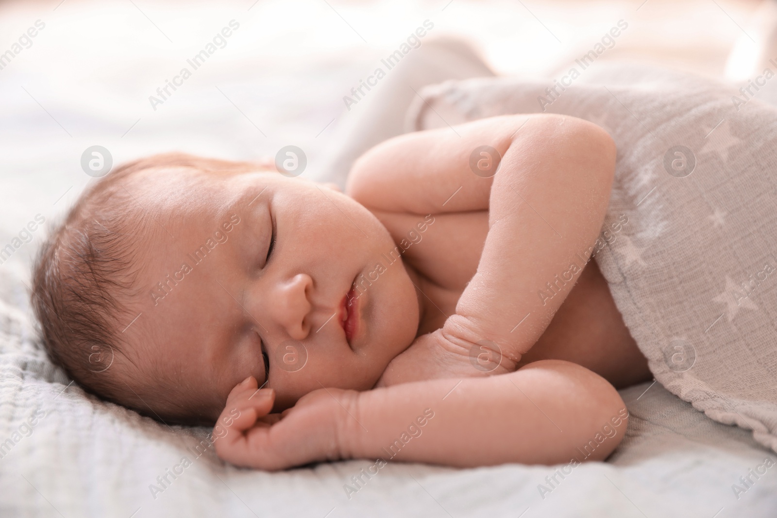 Bedtime. Cute little baby sleeping in bed indoors Photo of Bedtime. Cute little baby sleeping in bed indoors