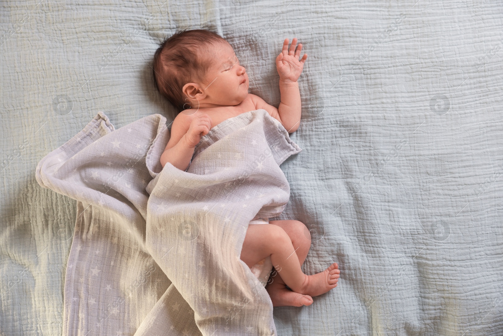 Bedtime. Cute little baby sleeping in bed indoors, top view Photo of Bedtime. Cute little baby sleeping in bed indoors, top view