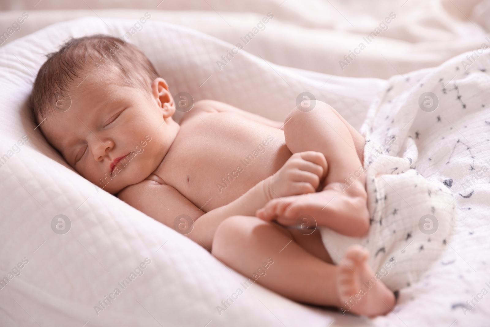 Bedtime. Cute little baby sleeping in lounger indoors Photo of Bedtime. Cute little baby sleeping in lounger indoors