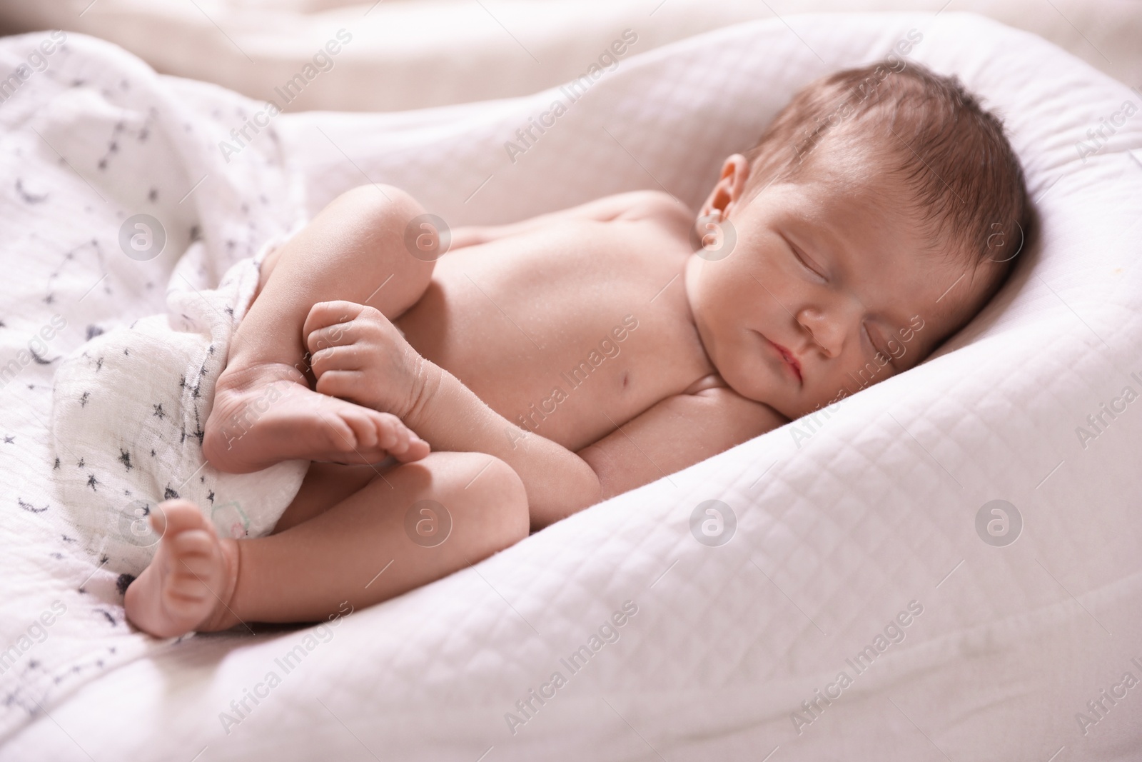 Bedtime. Cute little baby sleeping in lounger indoors Photo of Bedtime. Cute little baby sleeping in lounger indoors