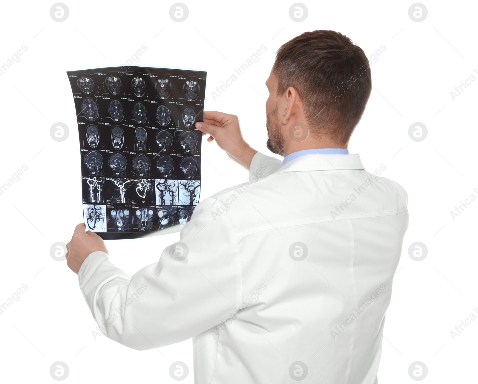 Doctor examining brain MRI scan in clinic on white background Photo of Doctor examining brain MRI scan in clinic on white background