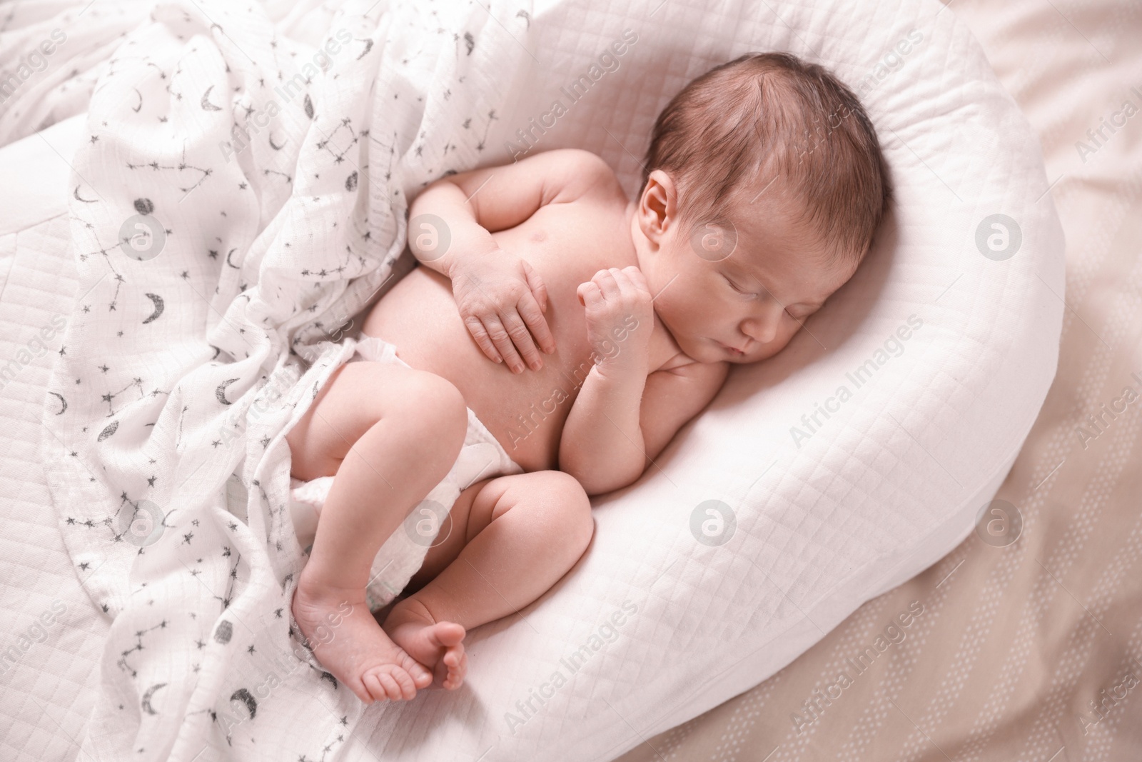 Bedtime. Cute little baby sleeping in lounger on bed indoors, top view Photo of Bedtime. Cute little baby sleeping in lounger on bed indoors, top view