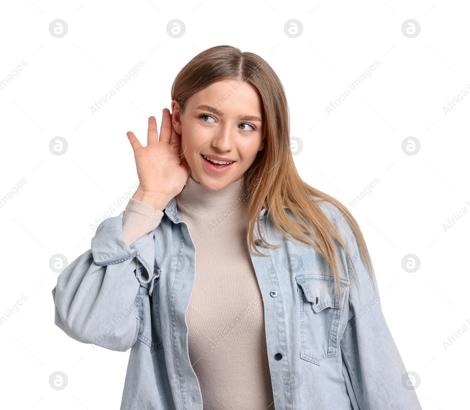 Smiling teenage girl showing hand to ear gesture on white background Photo of Smiling teenage girl showing hand to ear gesture on white background
