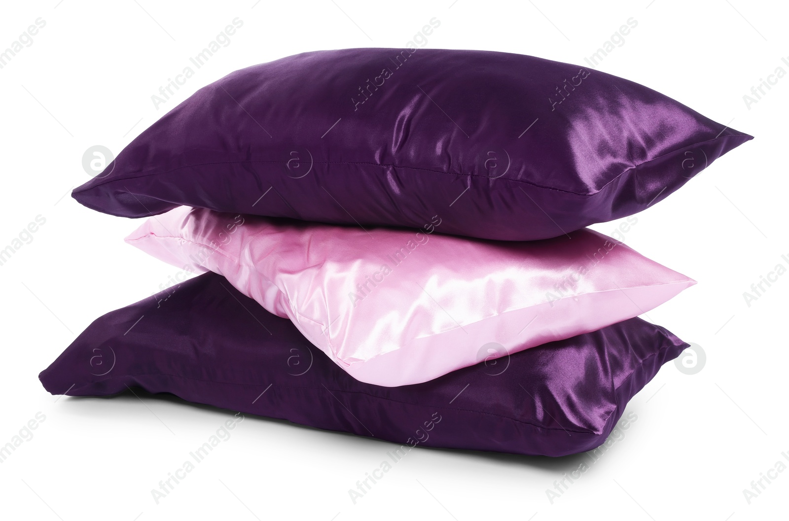 Pillows in pillowcases isolated on white. Silk bed linens Photo of Pillows in pillowcases isolated on white. Silk bed linens