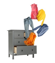 Image of Clothes flying out of dresser on white background