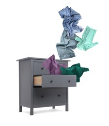Image of Clothes flying out of dresser on white background