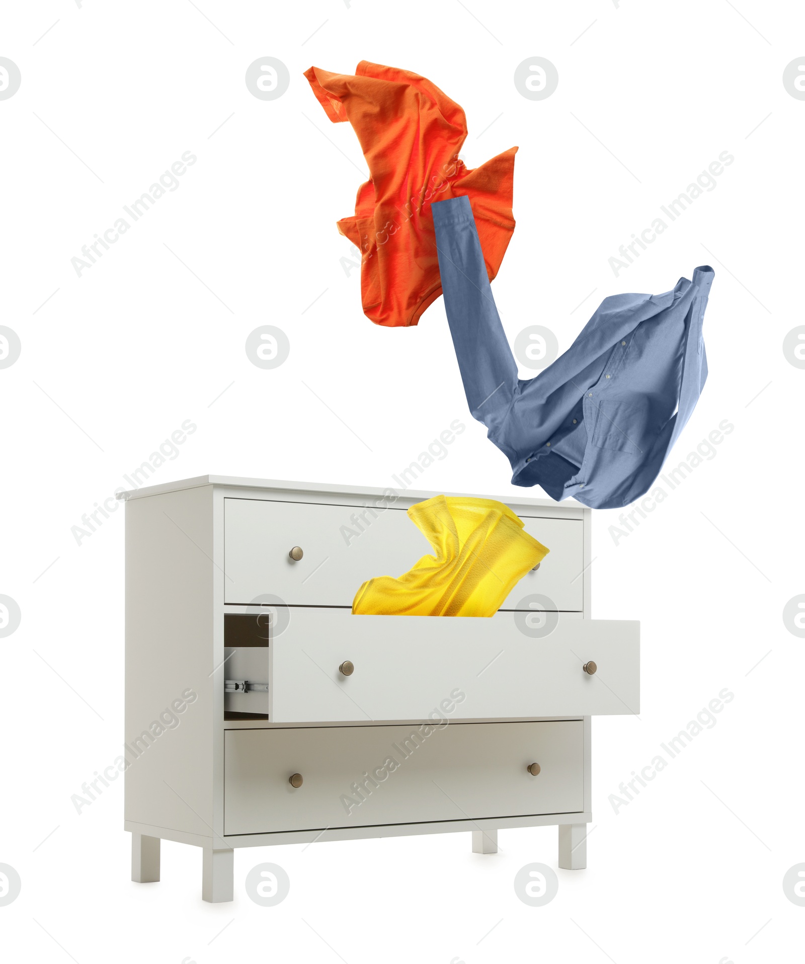 Clothes flying out of dresser on white background Image of Clothes flying out of dresser on white background