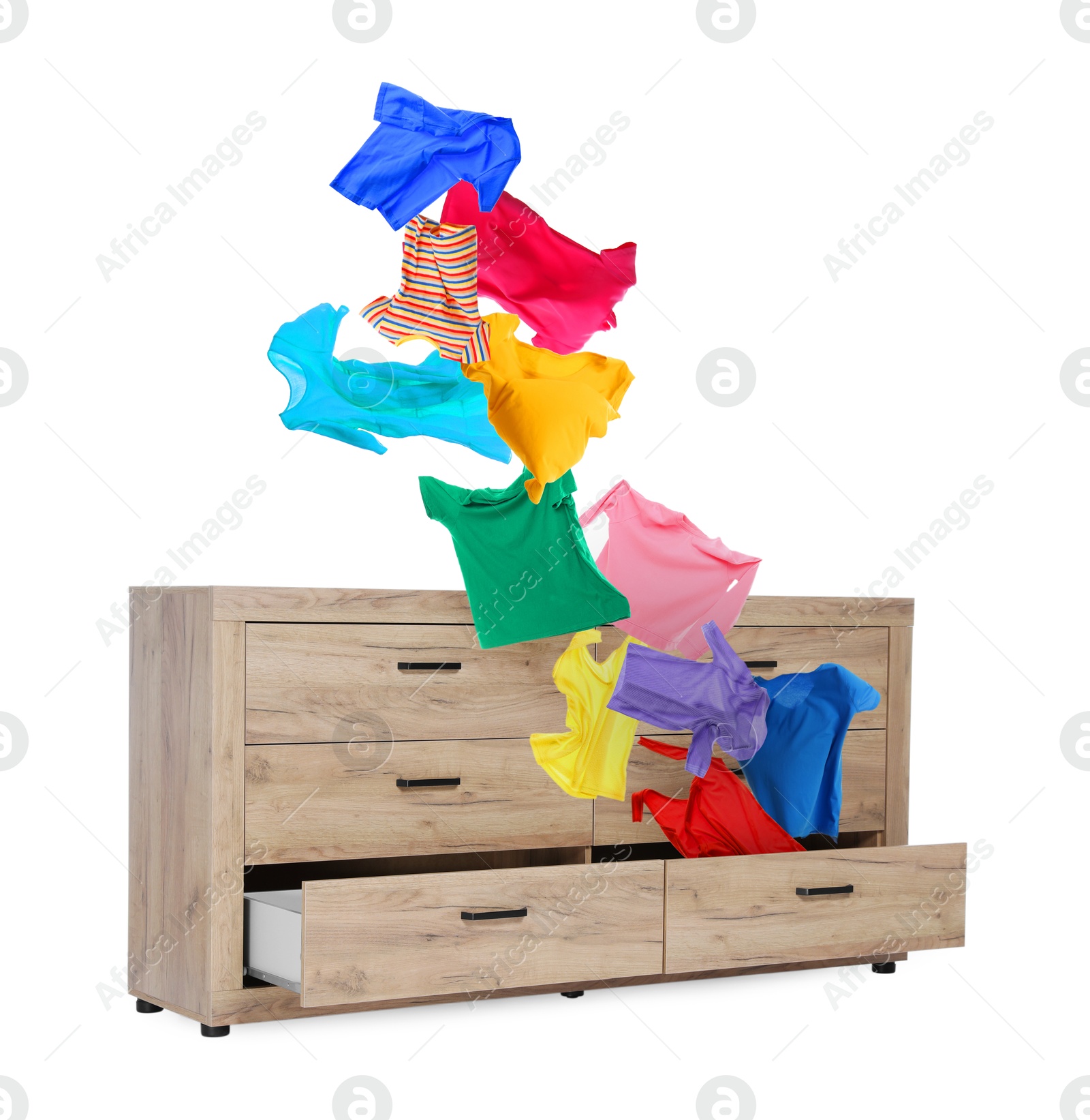 Clothes flying out of dresser on white background Image of Clothes flying out of dresser on white background