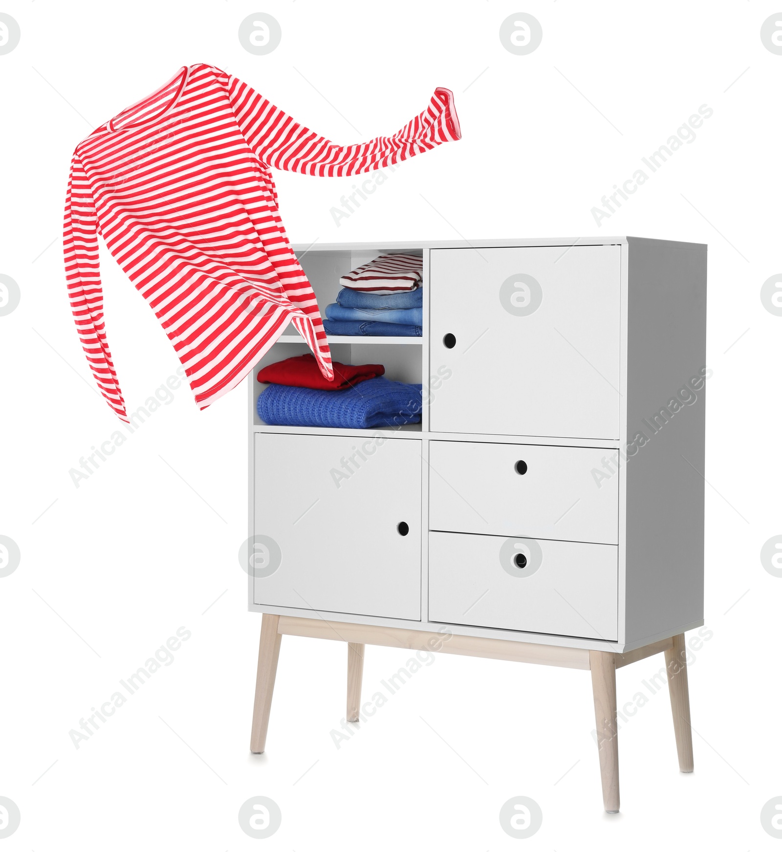 Striped shirt flying out of shelving unit on white background Image of Striped shirt flying out of shelving unit on white background