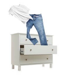 Image of Clothes flying out of dresser on white background