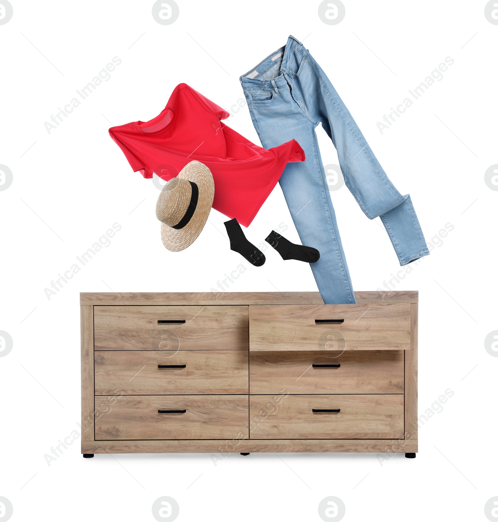 Clothes flying out of dresser on white background Image of Clothes flying out of dresser on white background