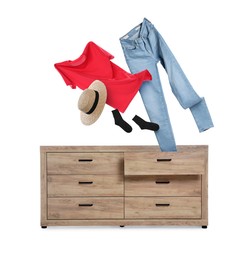 Image of Clothes flying out of dresser on white background