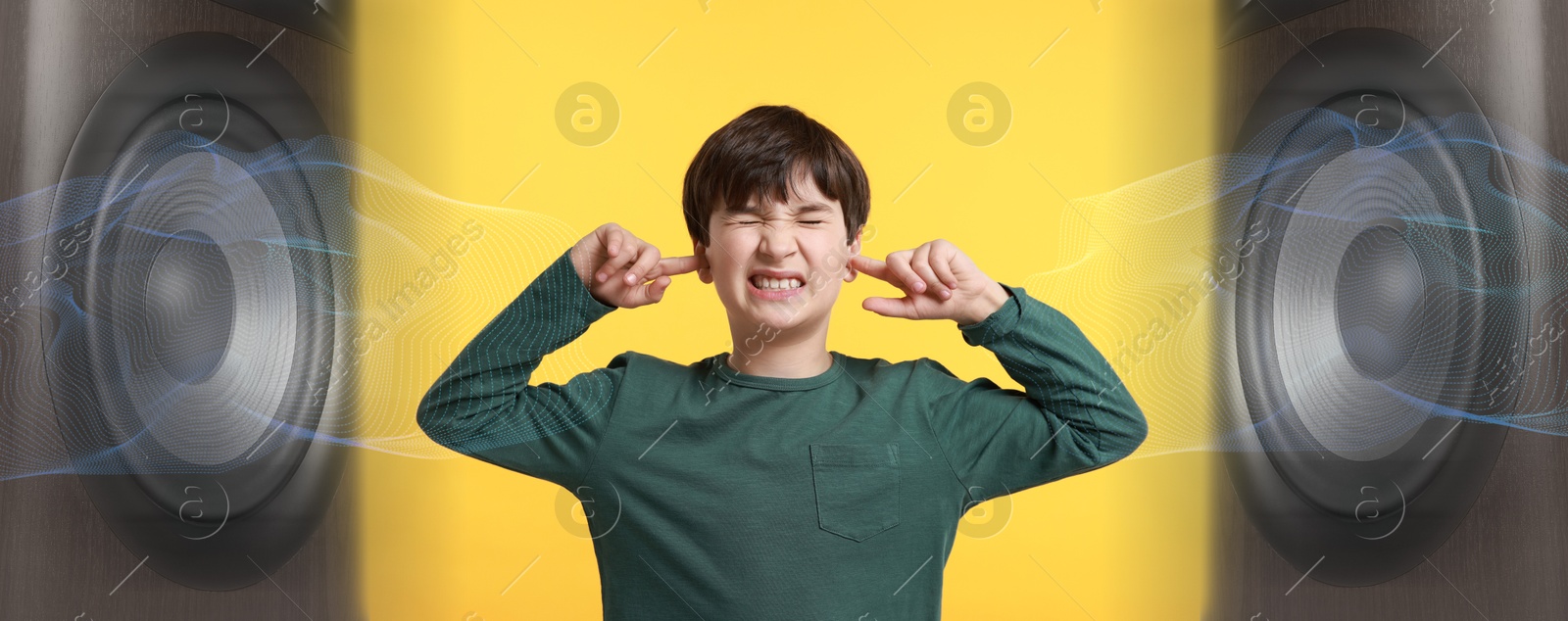 Annoyed boy covering his ears from loud sound of speakers on yellow background. Audio waves Image of Annoyed boy covering his ears from loud sound of speakers on yellow background. Audio waves