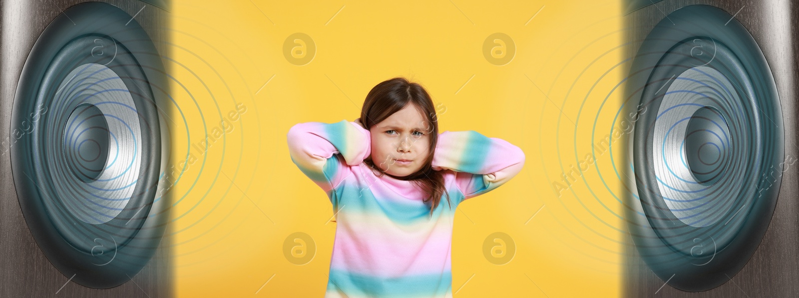 Annoyed girl covering her ears from loud sound of audio speakers on yellow background Image of Annoyed girl covering her ears from loud sound of audio speakers on yellow background