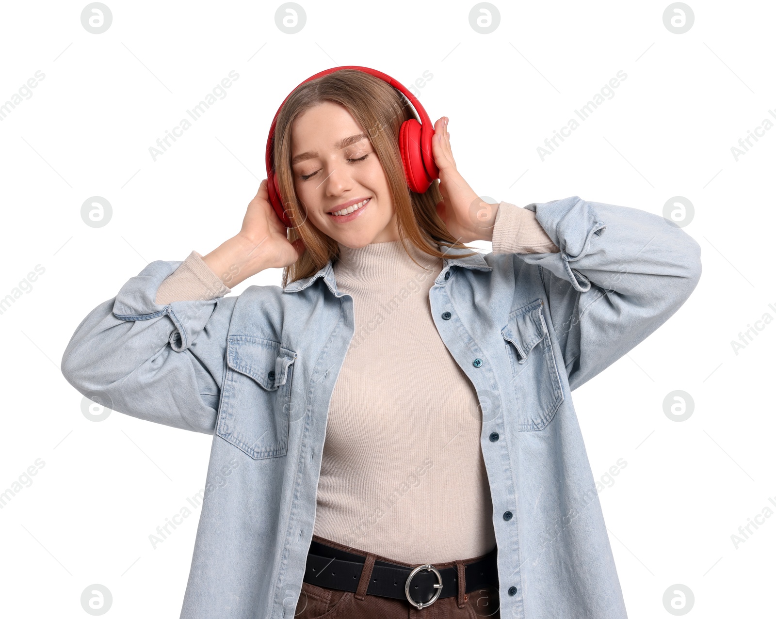 Photo of Smiling teenage girl in headphones listening to music on white background