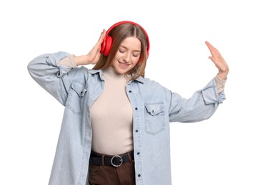 Photo of Smiling teenage girl in headphones listening to music on white background