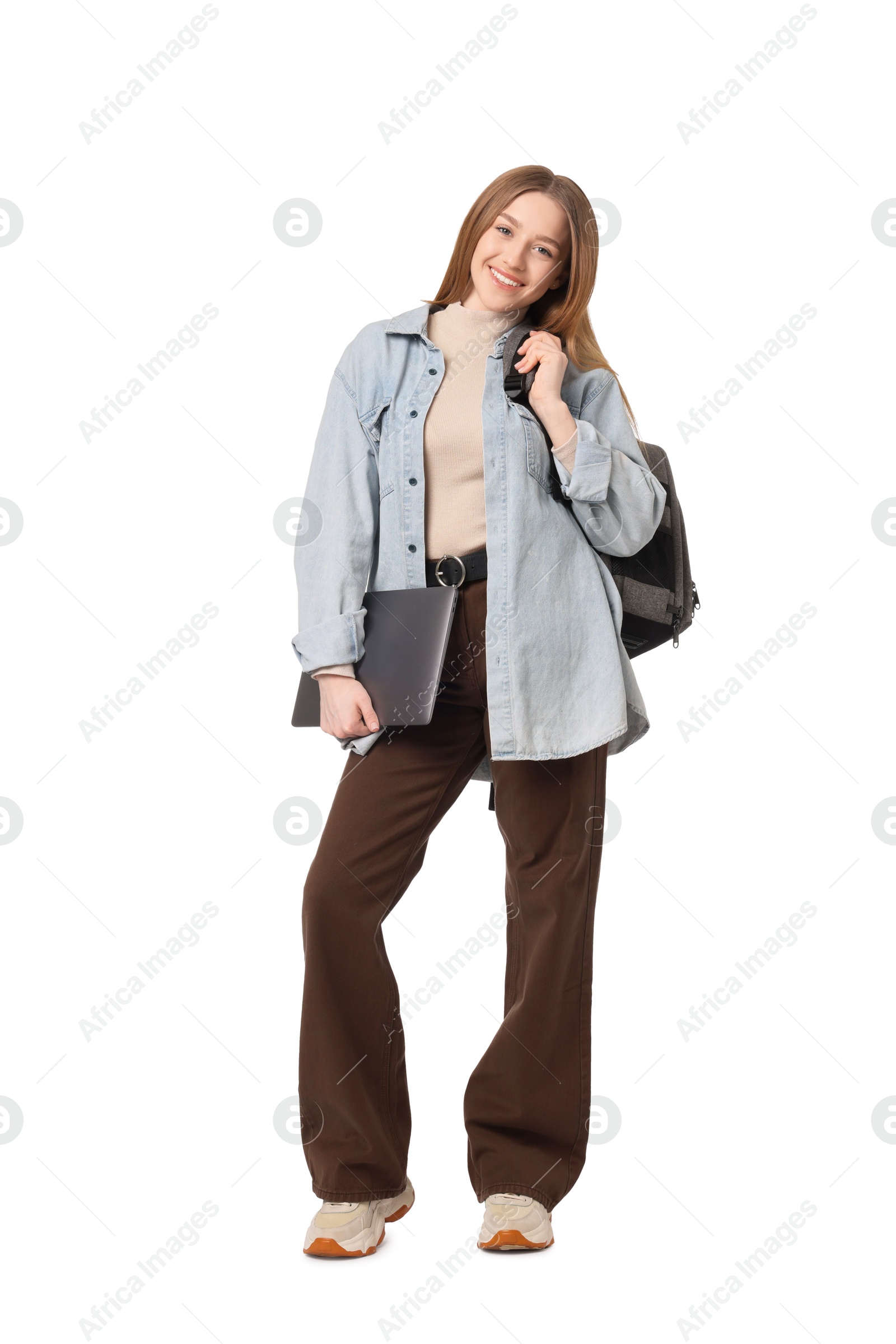 Smiling teenage girl with laptop on white background Photo of Smiling teenage girl with laptop on white background