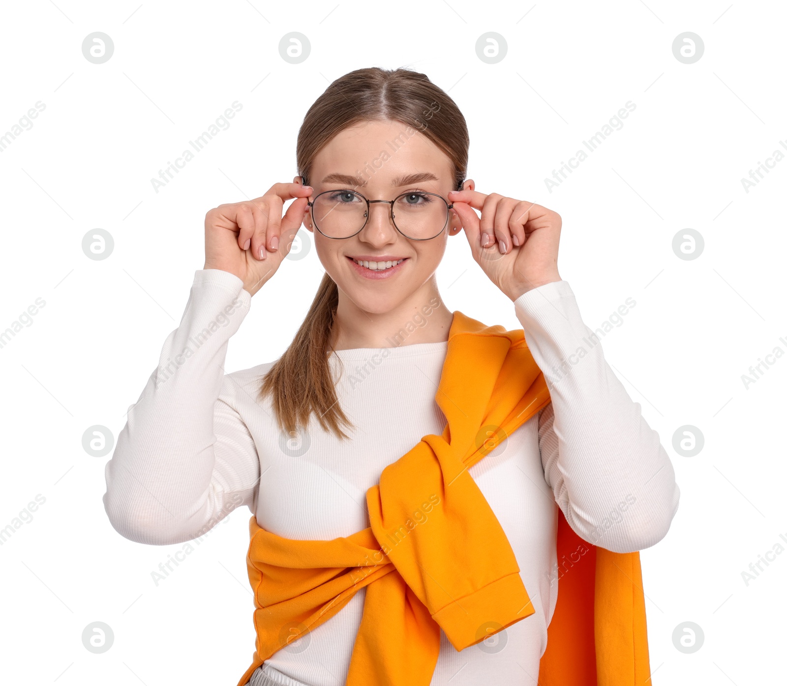 Portrait of smiling teenage girl on white background Photo of Portrait of smiling teenage girl on white background