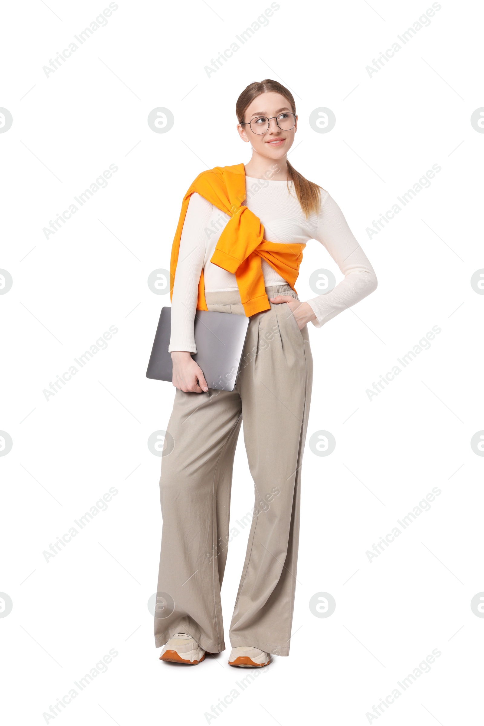 Smiling teenage girl with laptop on white background Photo of Smiling teenage girl with laptop on white background