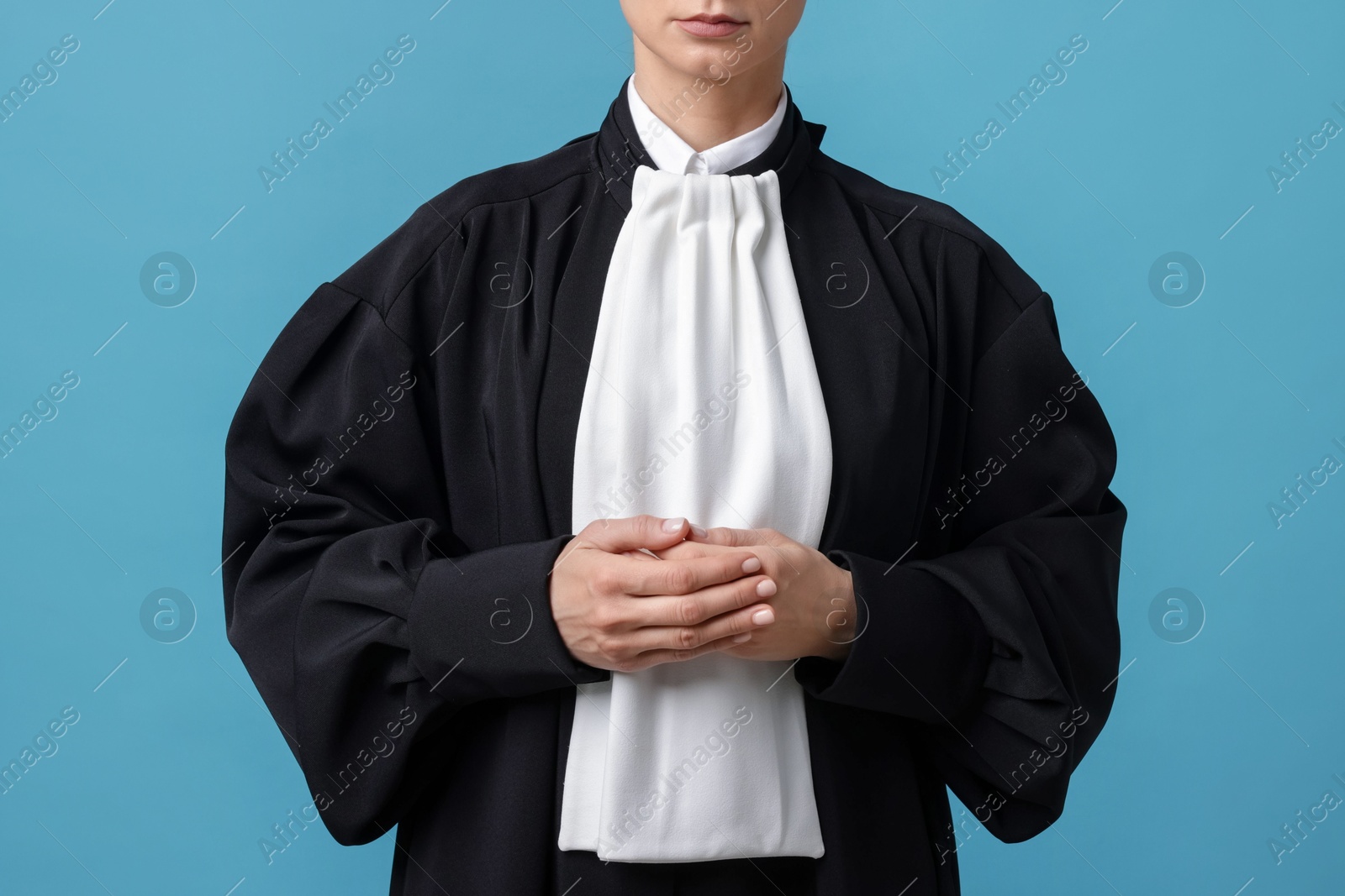 Judge on light blue background, closeup view Photo of Judge on light blue background, closeup view