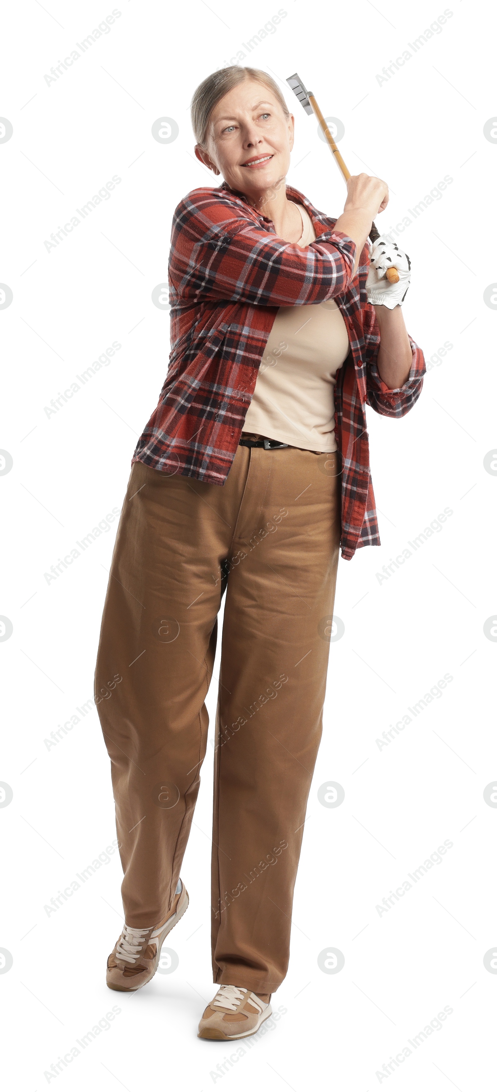 Senior woman with golf club on white background Photo of Senior woman with golf club on white background