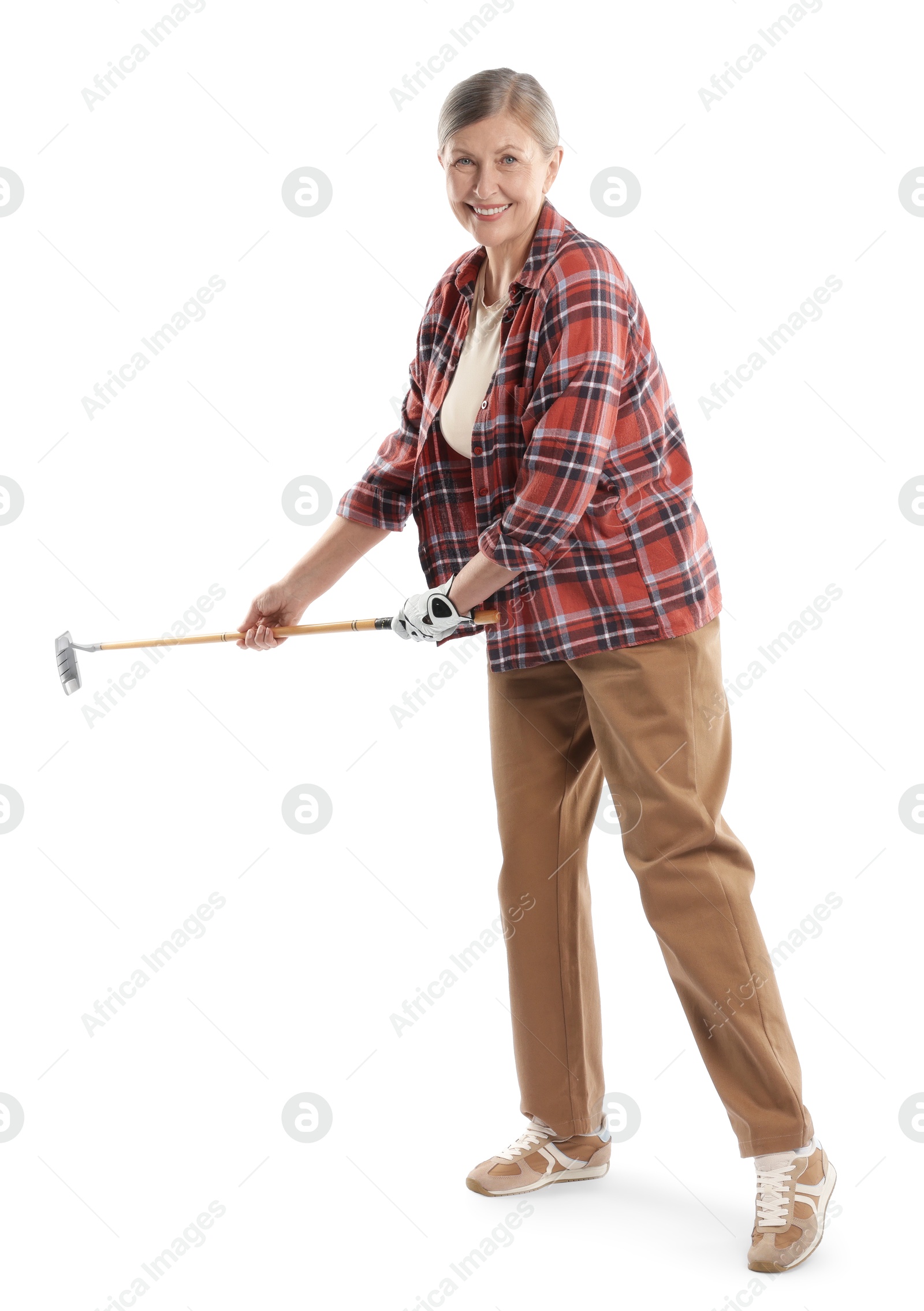 Senior woman with golf club on white background Photo of Senior woman with golf club on white background