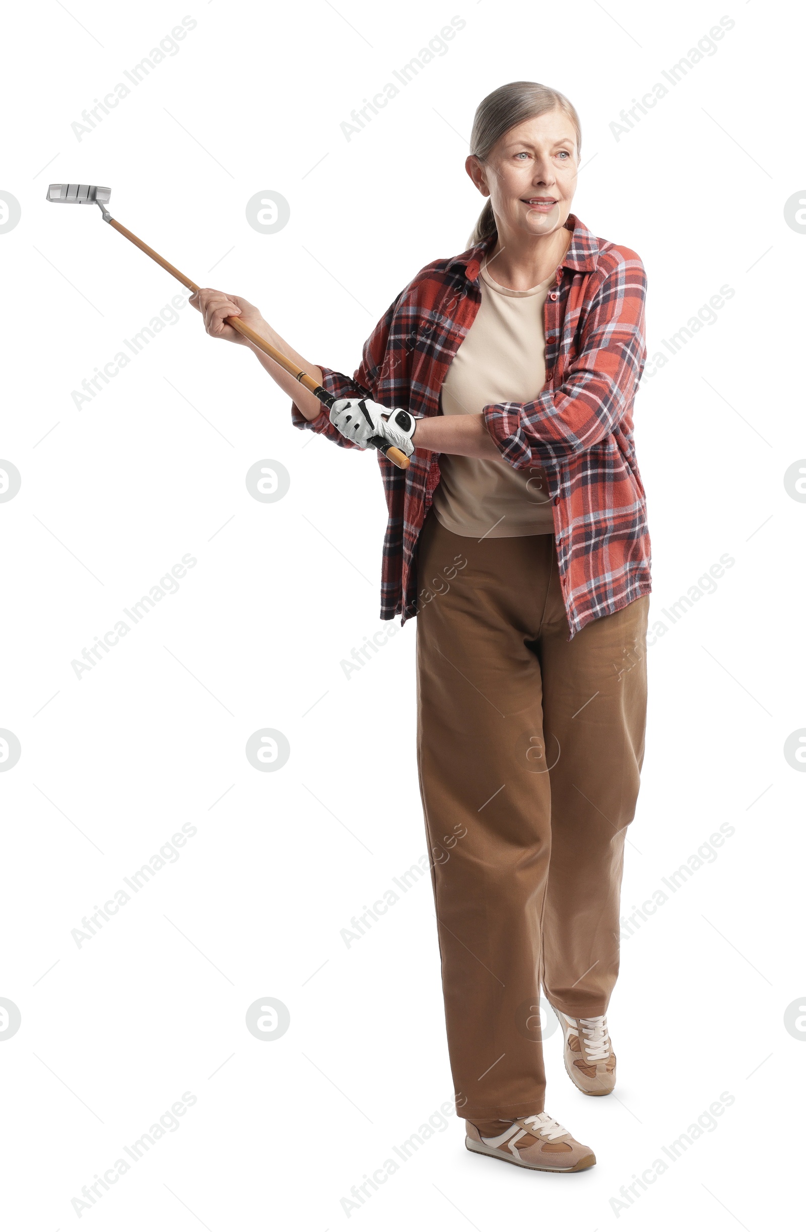 Senior woman with golf club on white background Photo of Senior woman with golf club on white background