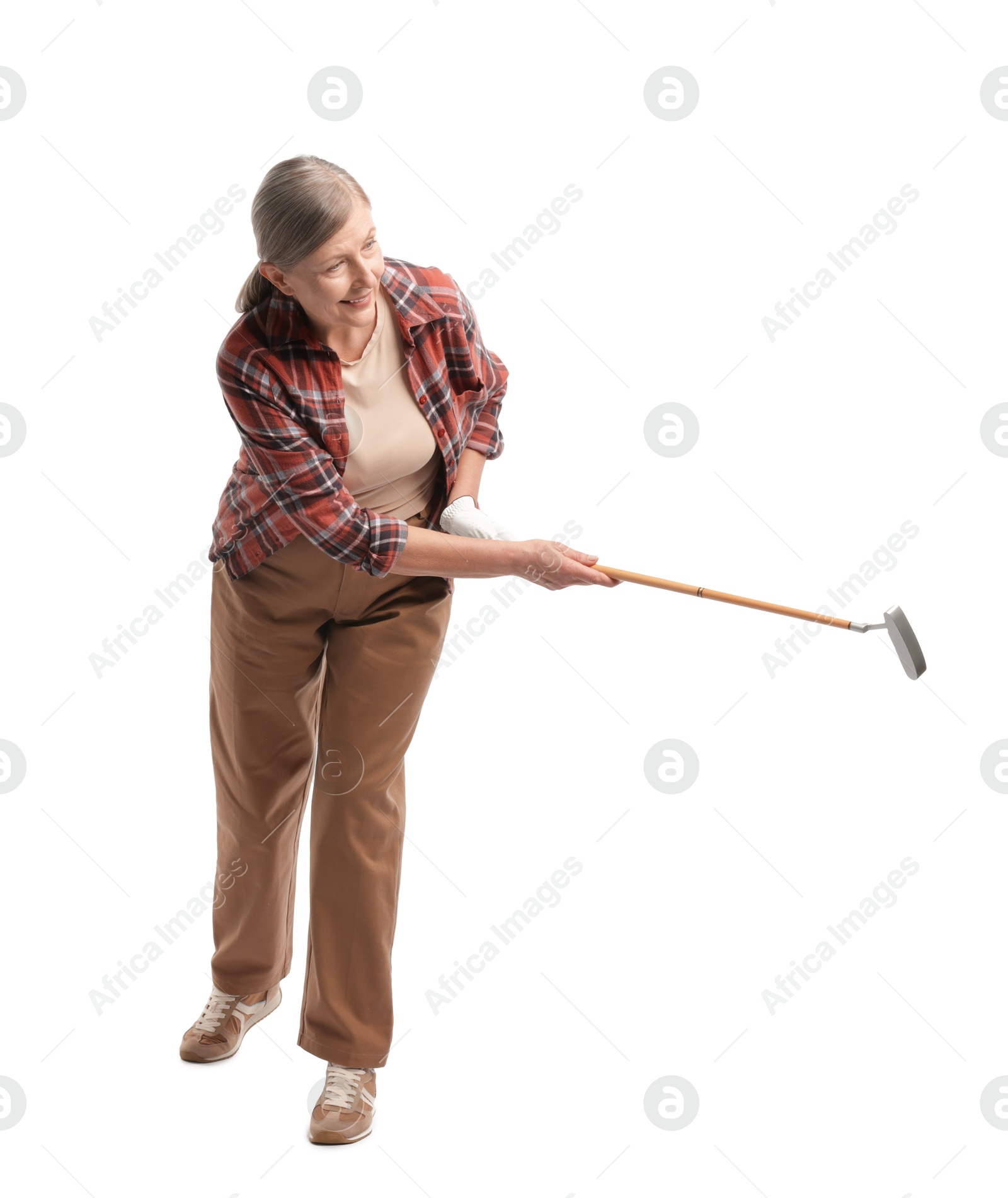 Senior woman with golf club on white background Photo of Senior woman with golf club on white background