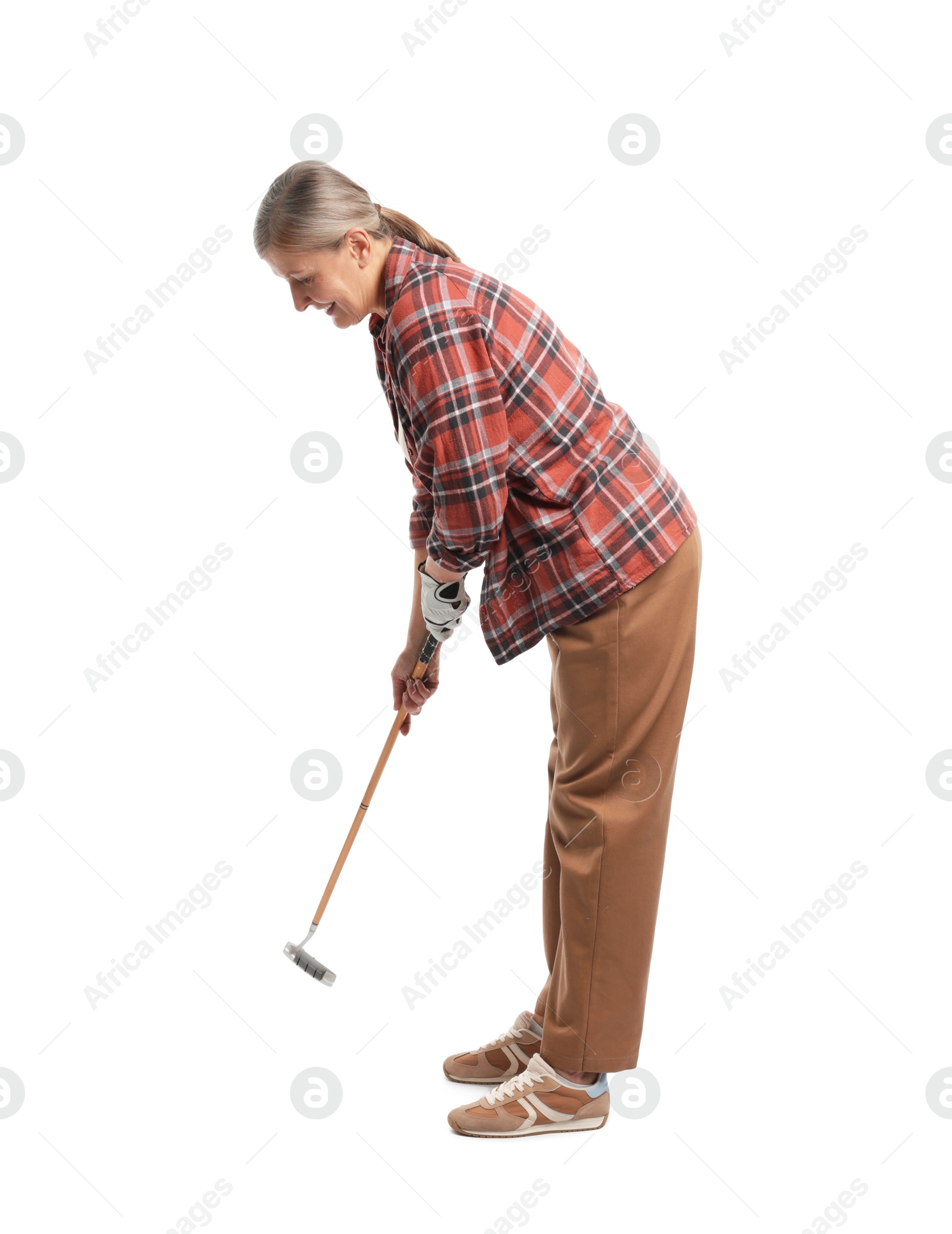 Senior woman with golf club on white background Photo of Senior woman with golf club on white background