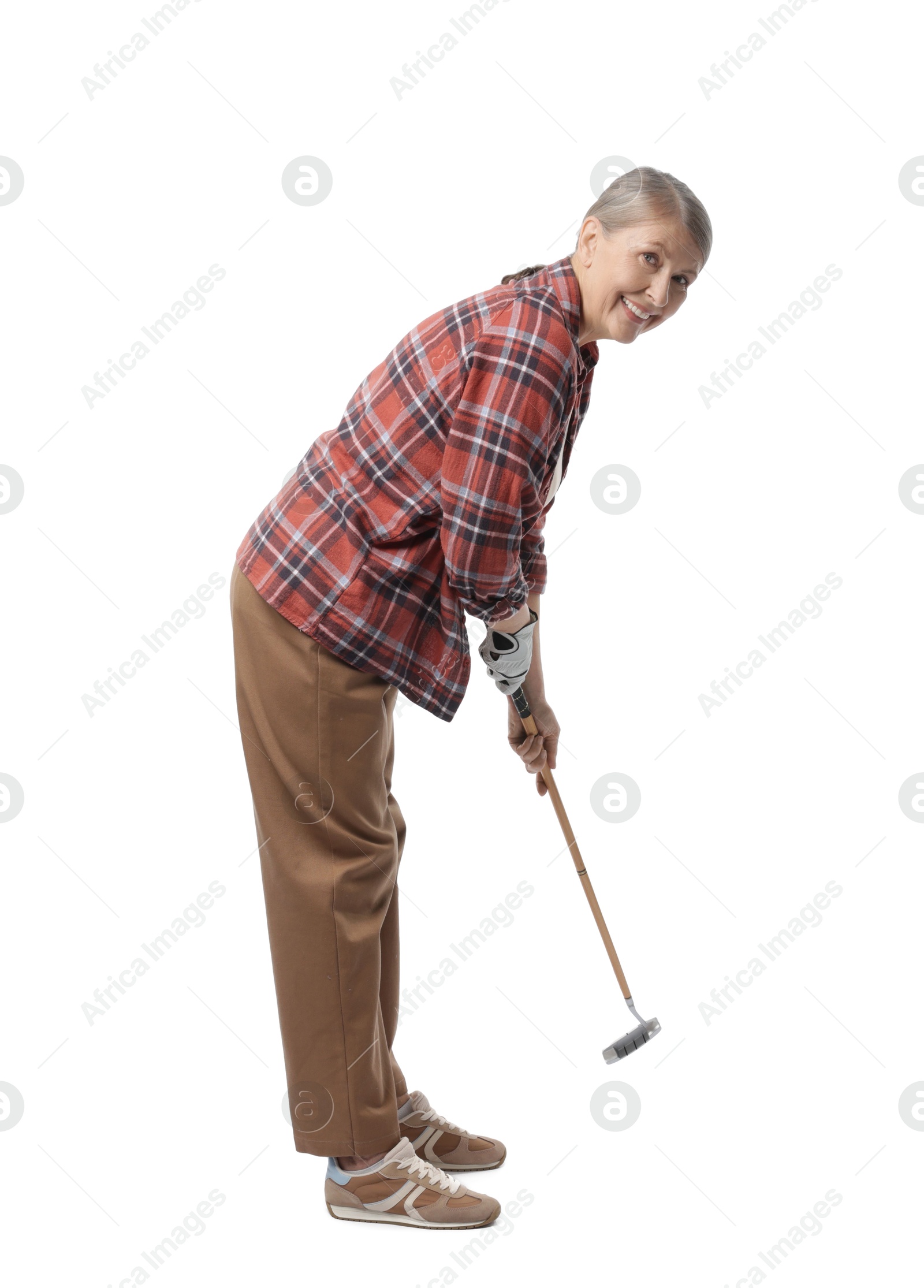 Senior woman with golf club on white background Photo of Senior woman with golf club on white background