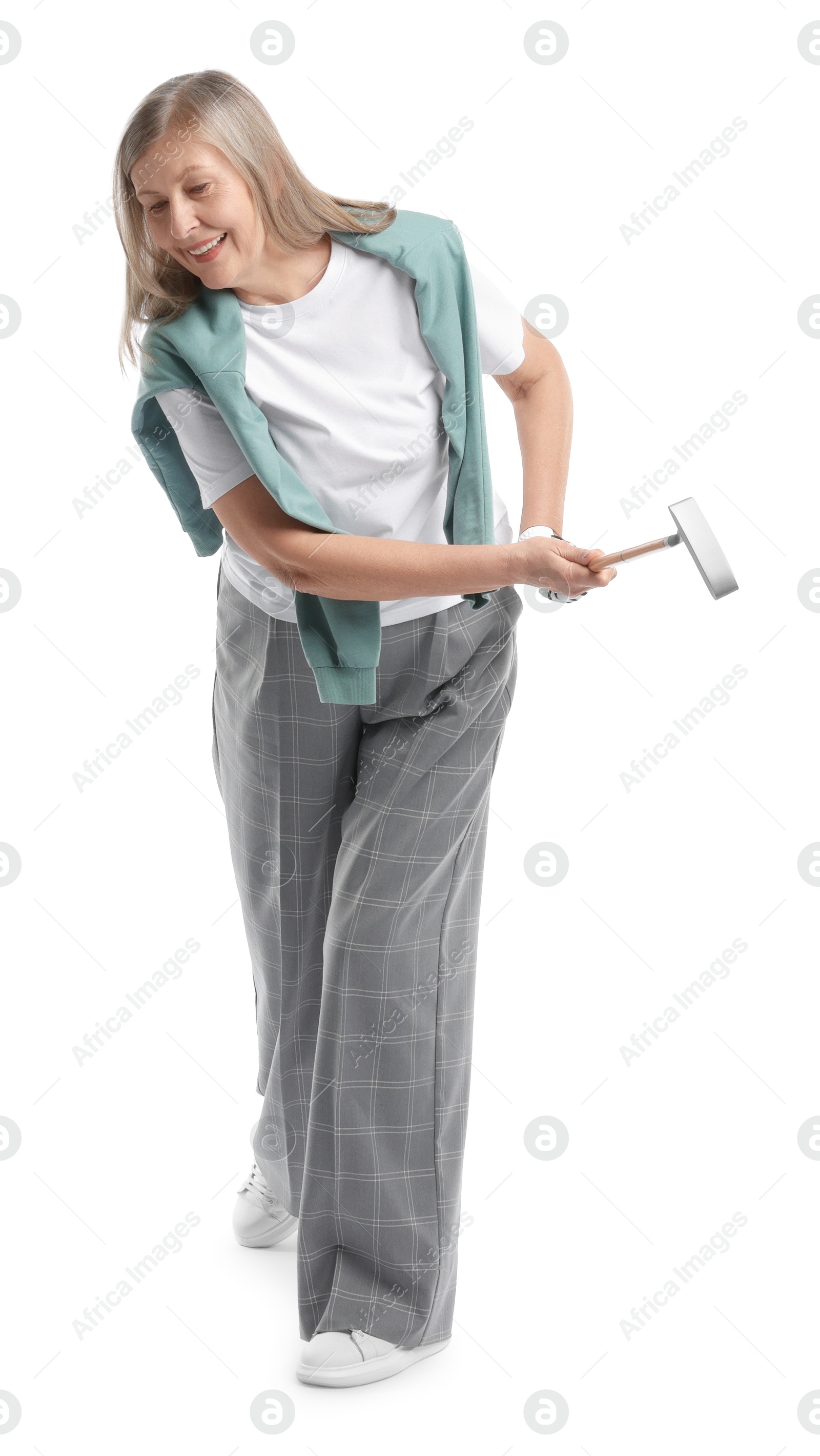 Senior woman with golf club on white background Photo of Senior woman with golf club on white background