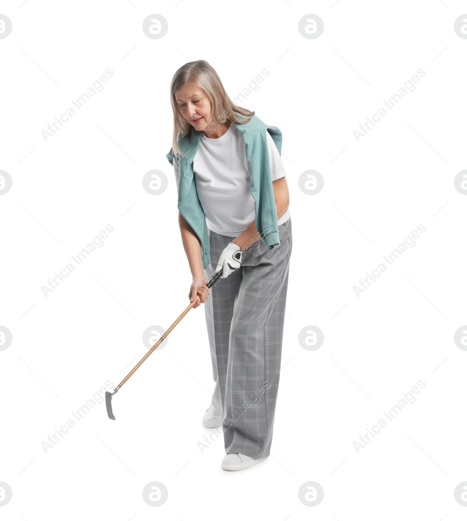 Senior woman with golf club on white background Photo of Senior woman with golf club on white background